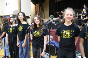 "School of Rock" singers in front of microphones